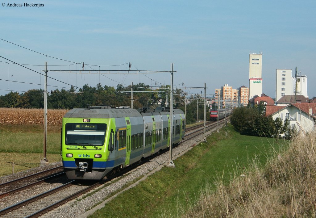 460 112-6 mit dem IC 725 (Geneve-Aeroport-St. Gallen(CH)) begegnet NINA 26 der BLS als S1 (Thun-Fribourg) bei Ddingen 3.10.0