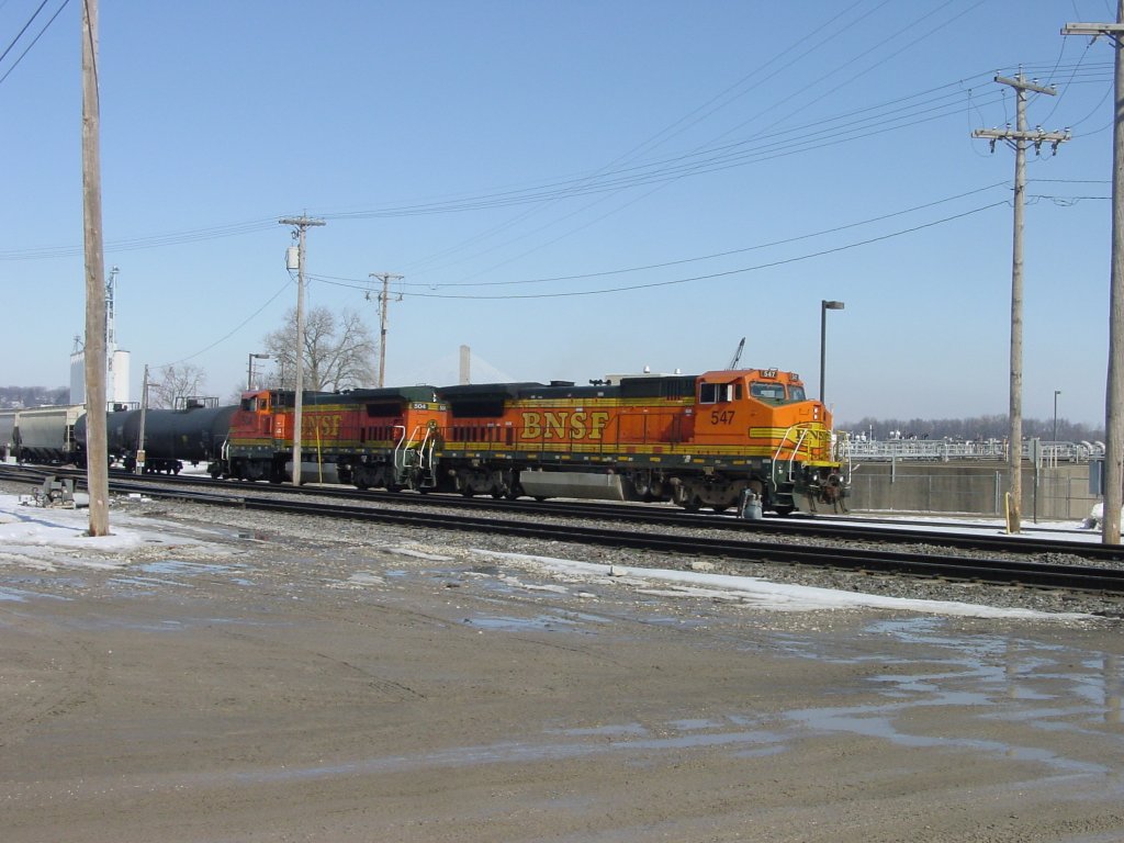 A pair of BNSF diesel locomotives perform switching duties in the yard at Burlington, Iowa. 3 Mar 2010.