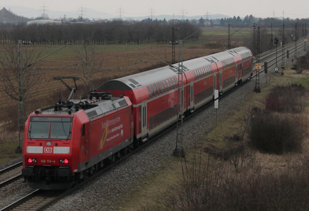 Am 02.03.2013 schob 146 114-4 ihren RegionalExpress Richtung Freiburg. Hier ist der RE kurz hinter Mllheim (Baden).