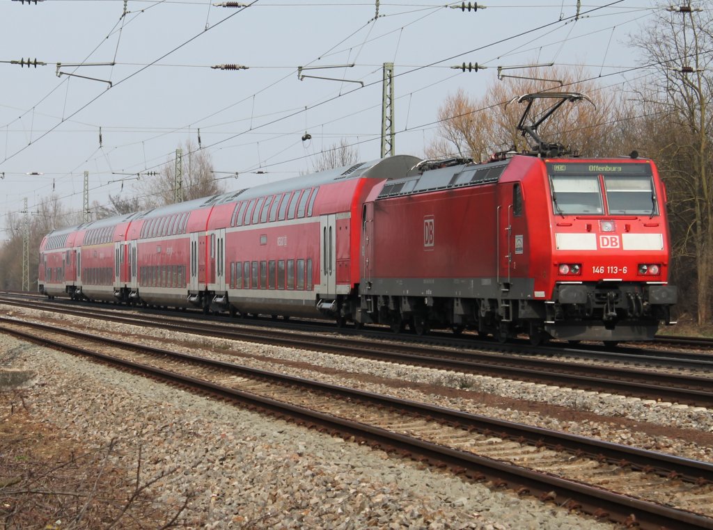 Am 29.03.2013 schob 146 113-6, noch ohne Werbung, einen RE gen Norden in Orschweier.