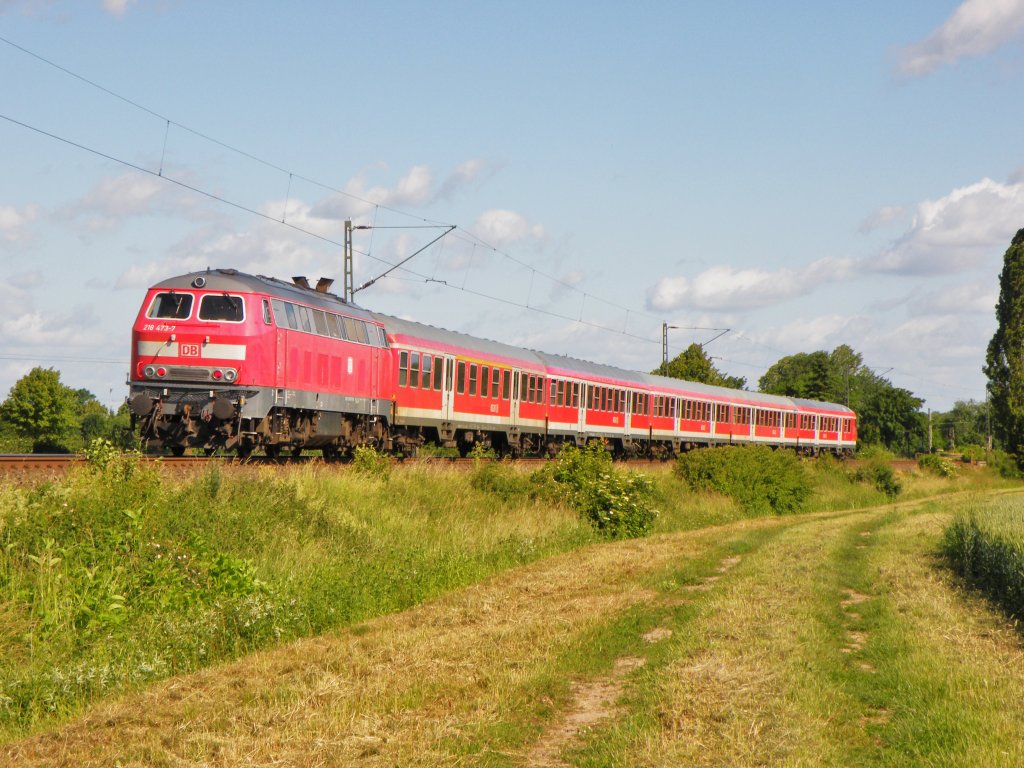 Am 9.Juni 2012 war 218 473 mit einem RE aus Bad Harzburg bei Rssing/Barnten auf dem Weg nach Hannover Hbf.