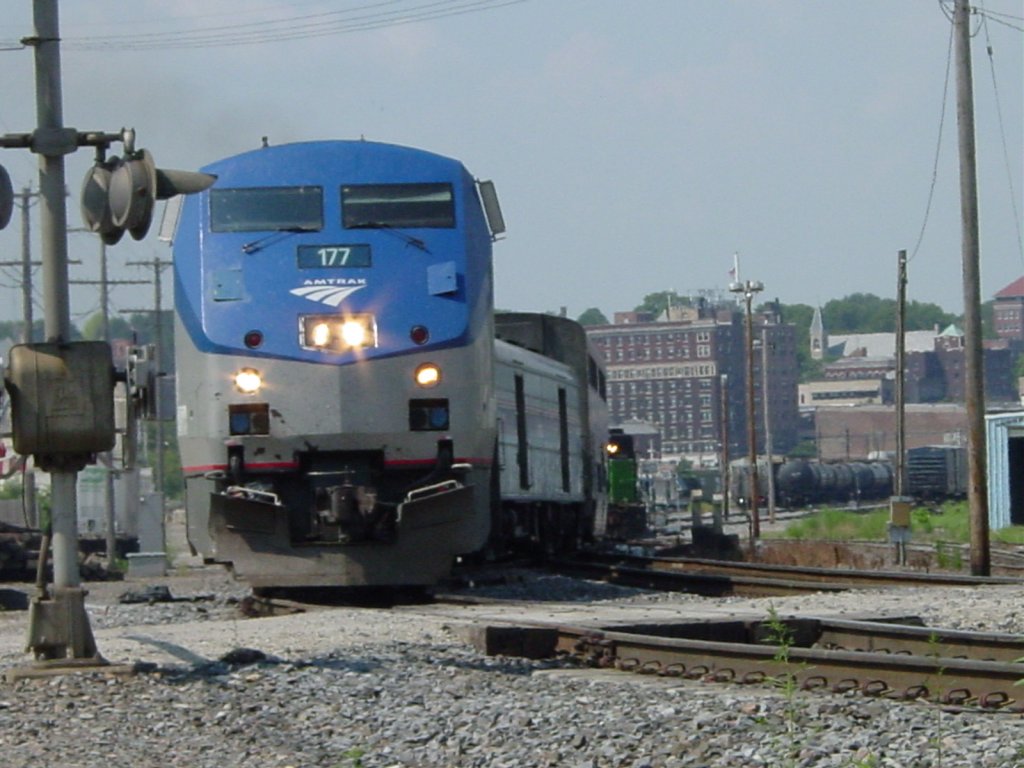 Amtrak 177 pulls train out of Burlington, Iowa yard through South Street intersection on its afternoon journey to Chicago on 30 July 2003.