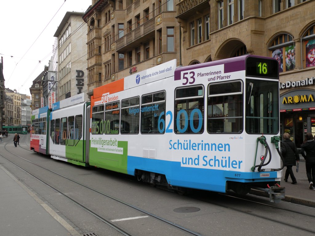 Be 4/6 S mit der Betriebsnummer 677 mit der Werbung fr die reformierte Kirche Basel-Stadt bedient die Haltestelle Marktplatz auf der Linie 16. Die Aufnahme entstand am 26.20.2009.