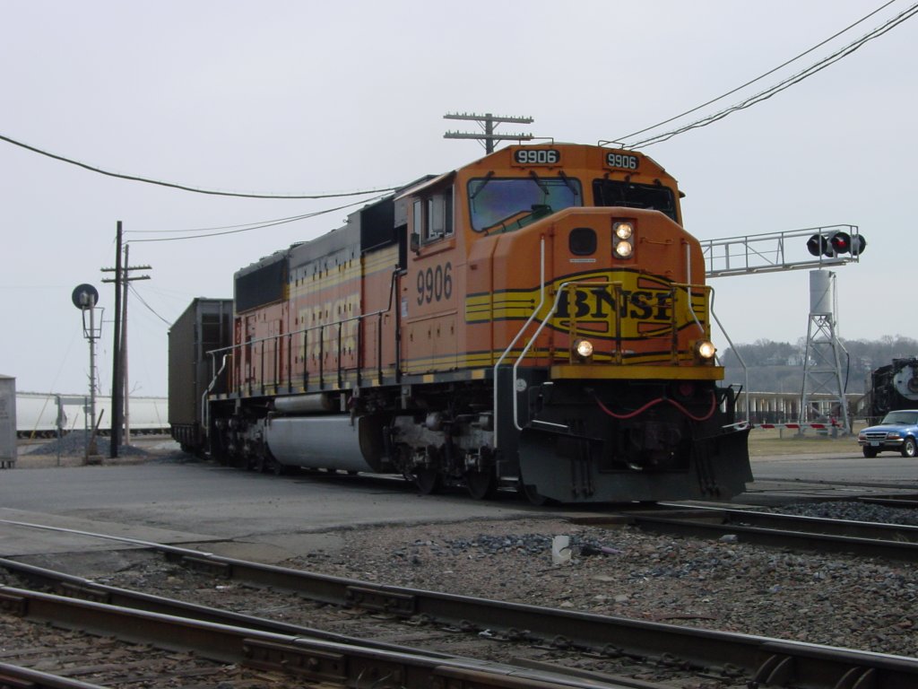 BNSF 9906 occupies Main Street Burlington, Iowa on 27 Feb 2006. Lok is by itself, but another unit pushes from the back as this train finds its way back to the coal fields near Wright, Wyoming.
