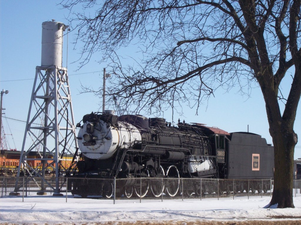 Chicago, Burlington & Quincy 4-6-4 No. 3003 sits at the Burlington, Iowa depot since 1961. It was mostly used for passenger service. A sand tower is displayed next to the lok. Feb 2010.