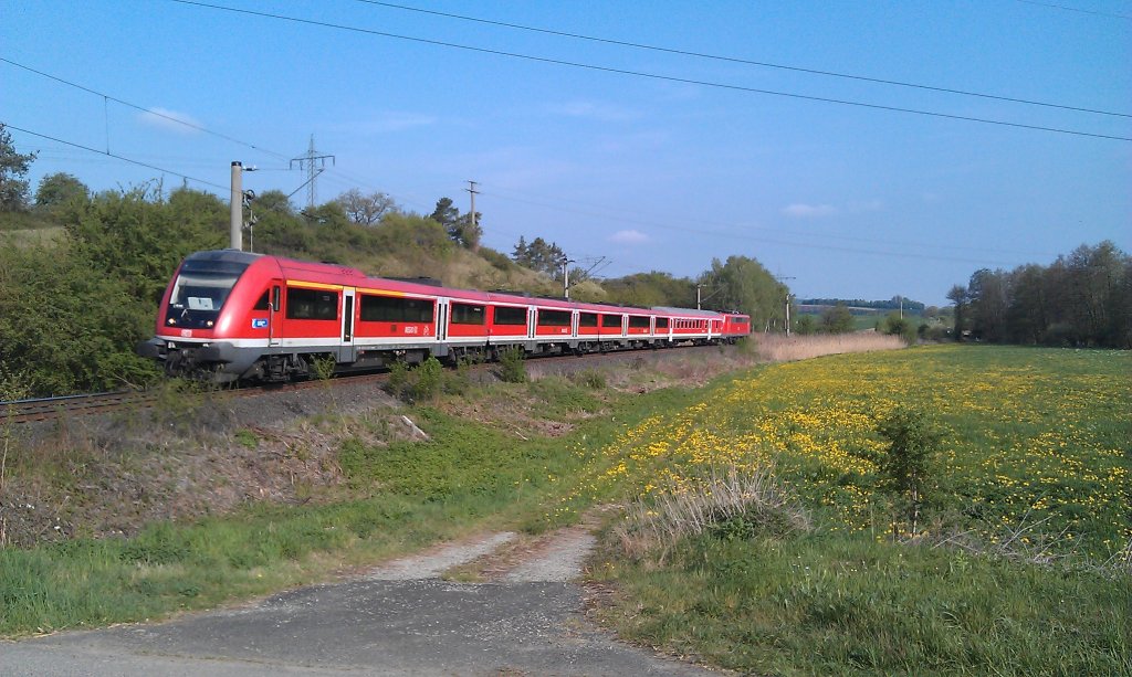 Der  Fahrrad-Regionalexpress  Aschaffenburg - Bamberg durchfhrt am 01.05.2012 mit schiebender BR 111 das Werntal bei Stetten. 