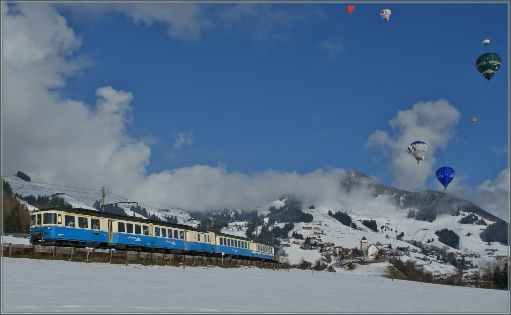Der MOB ABDe 8/8 4001 SUISSE mit dem Regionalzug 2221 vor der Kulisse der Ballonfestivals von Château d'Oex auf dem Weg nach Montreux.
28. Jan. 2013