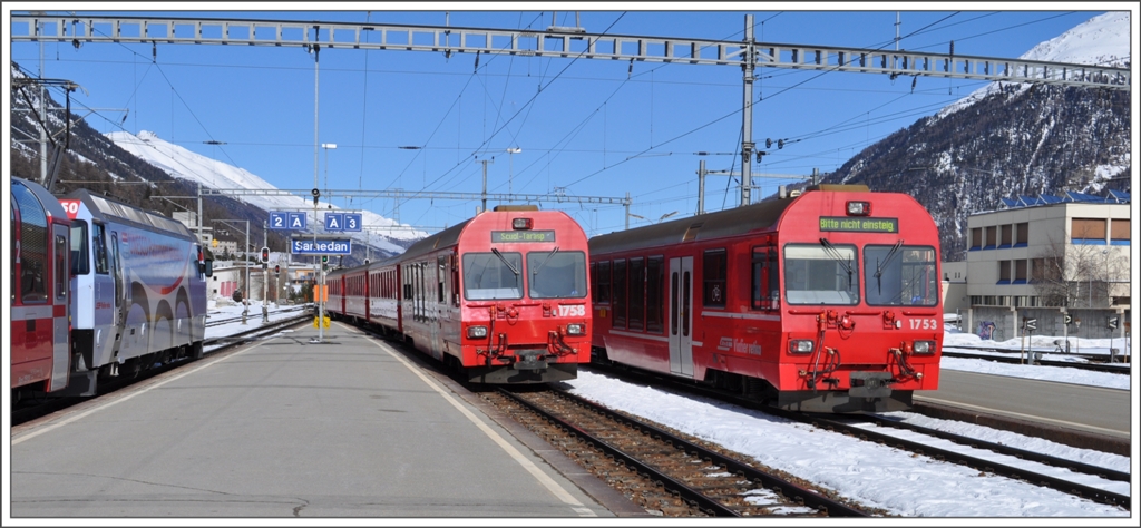 Der RE1148 mit Ge 4/4 III 650  Seewis-Valzeina  nach Chur wartet in Samedan bis der R1948 nach Scuol-Tarasp in Bever eingetroffen ist. (26.02.2011)