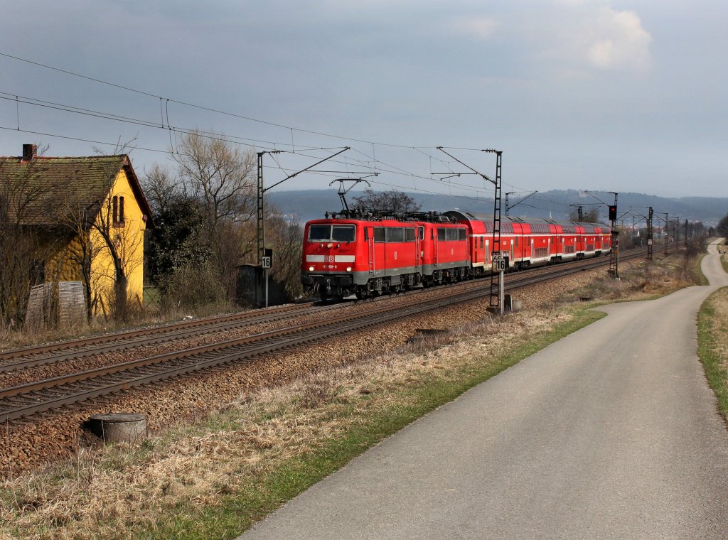 Die 111 159 und die 111 208 mit einem RE nach N�rnberg am 24.03.2012 unterwegs bei P�lling.