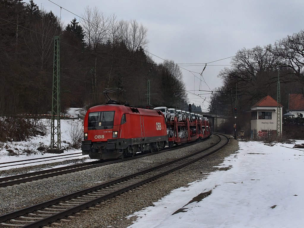 Die 1116 140 mit einem Gterzug am 13.03.2010 bei der Durchfahrt in Aling. 