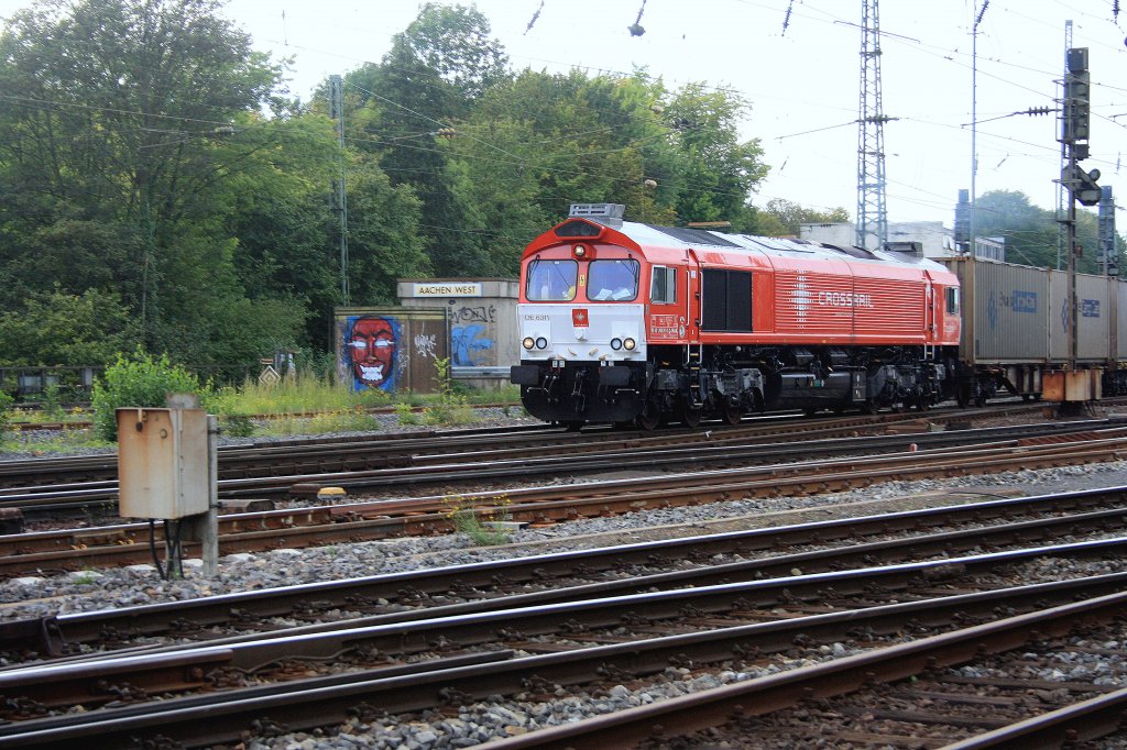 Die Class 66 DE6311  Hanna  von Crossrail f�hrt mit einem gemischten Containerzug von Aachen-West nach Belgien bei Wolken.
10.9.2011