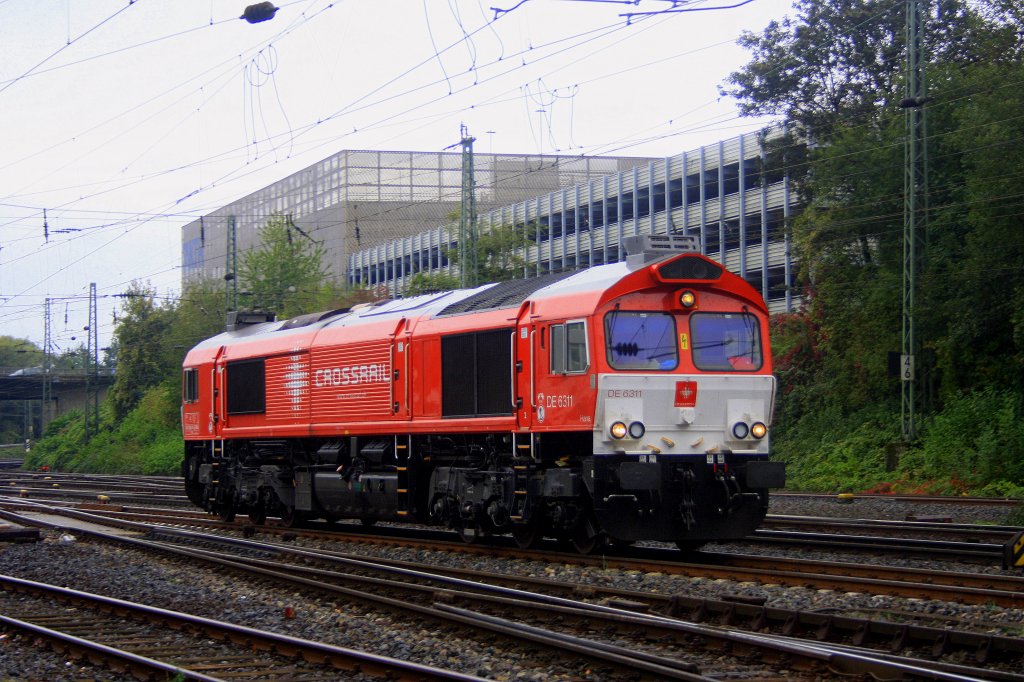 Die Class 66 DE6311  Hanna  von Crossrail kommt als Lokzug aus Montzen/Belgien und fhrt in Aachen-West ein bei Regenwetter.
8.10.2011