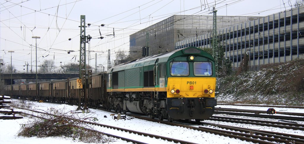 Die Class 66 PB01 von der Rurtalbahn-Cargo  kommt mit einem Bleizug aus Antwerpen-Lillo(B) nach Stolberg-Hammer und fhrt in Aachen-West ein im Schnee am 18.1.2013.
