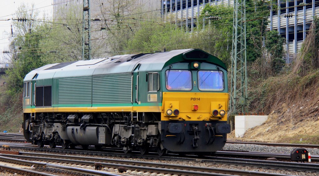 Die Class 66 PB14 von Railtraxx BVBA kommt als Lokzug aus Montzen(B) und fhrt in Aachen-West ein bei Wolken am 21.4.2013.