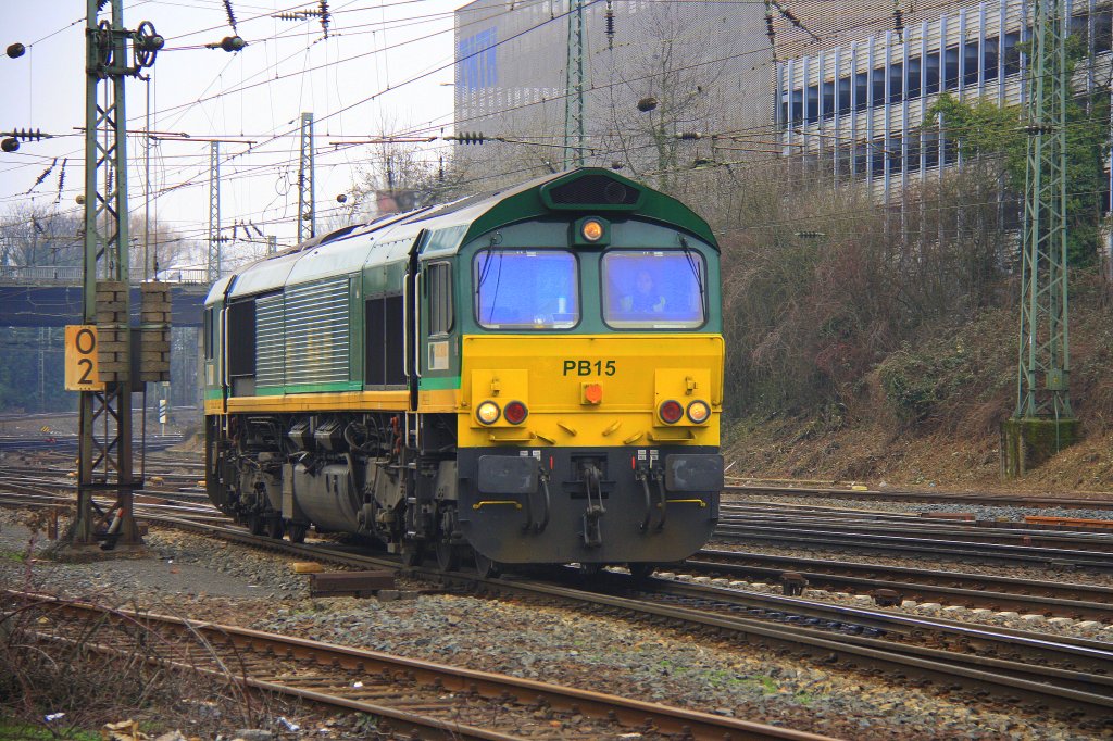 Die Class 66 PB15 von Railtraxx BVBA rangiert in Aachen-West bei Wolken am 13.3.2012.