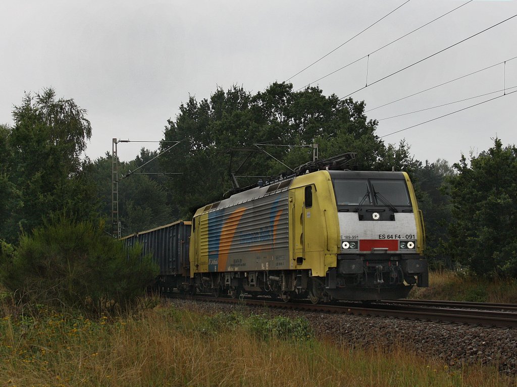 Die ES 64 F4-091 am 11.08.2010 mit einem Gterzug unterwegs bei Eystrup. 
