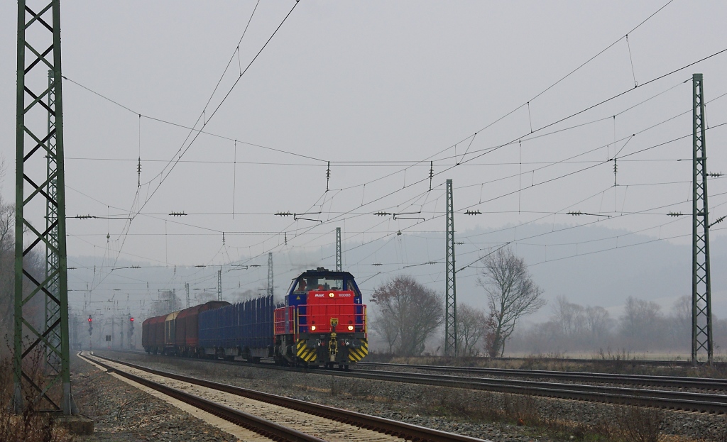 Die MAK G1000BB der HGL mit einem bergabezug aus Bebra kommend in Richtung Bad Hersfeld. Hier bei Mecklar. Aufgenommen am 19.02.2011.