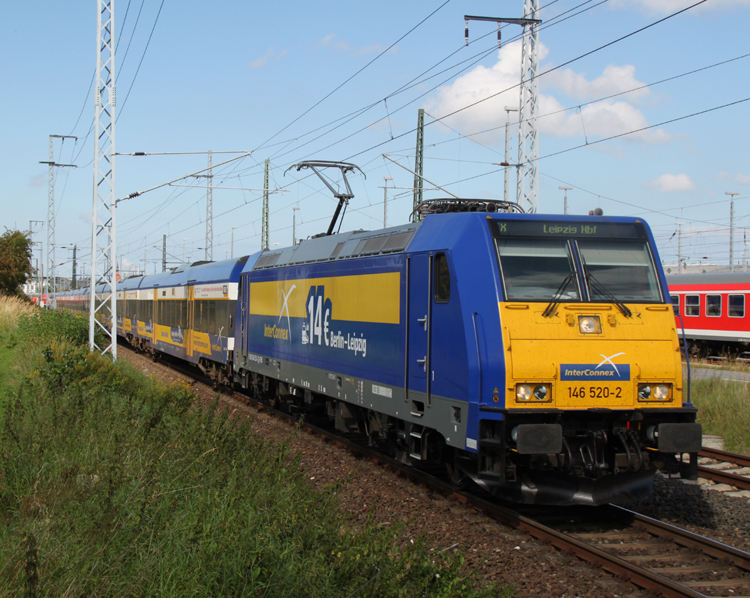 Die neue Werbelok beim InterConnex:146 520-2 mit X 68904 von Warnemnde nach Leipzig Hbf bei der Ausfahrt im Rostocker Hbf.02.09.2011