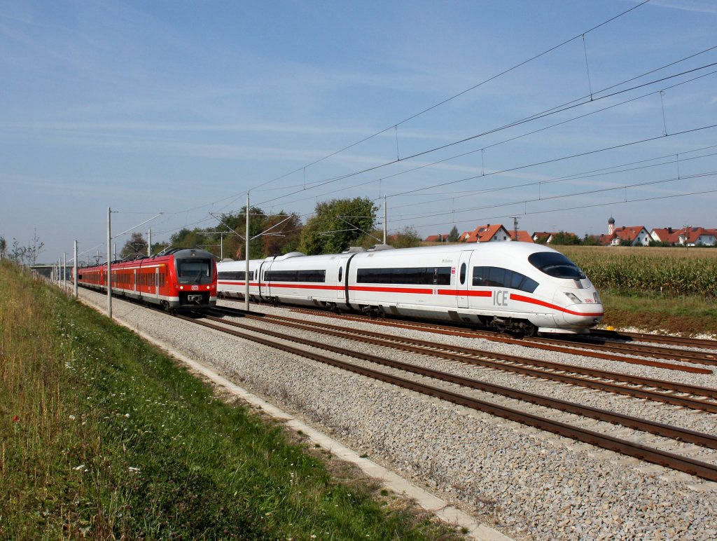 Die Parallelfahrt eines ICE 3 und dem 440 029 am 24.09.2011 bei Hattenhofen.
