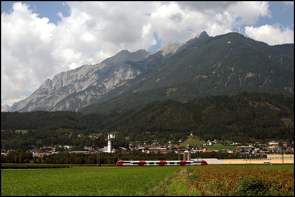 Ein Talent ist im Inntal bei Schwaz als RB 5116, Tefls-Pfaffenhofen – Rosenheim unterwegs. (07.08.2009)