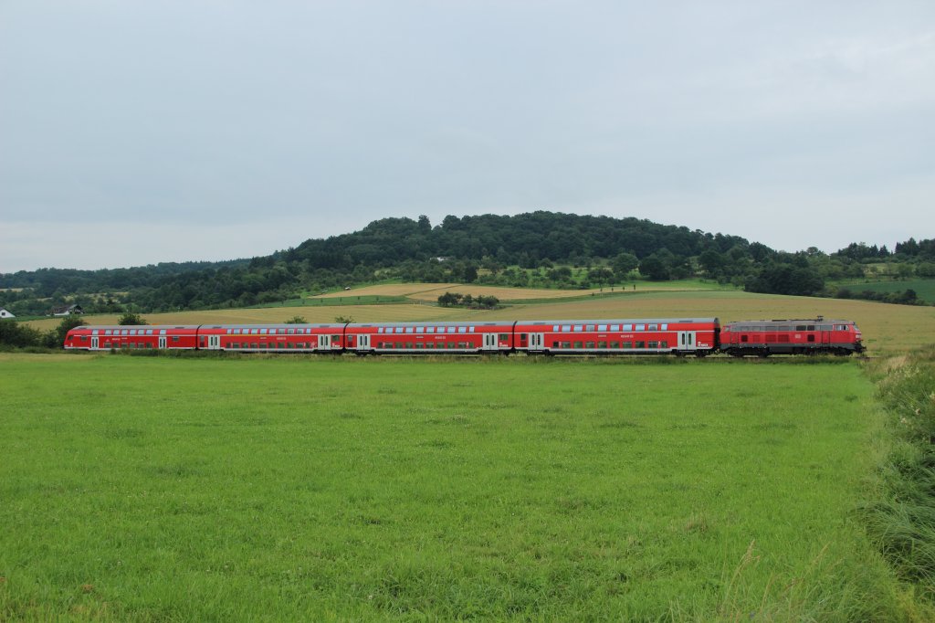 Eine unbekannte 218 mit einem Regionalexpress am 02.07.2012 zwischen Glauburg-Stockheim und Glauburg-Glauberg