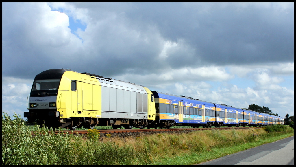 ER20-011 der Nord-Ostsee-Bahn mit den Nordsee Werbewagen unterwegs nach Westerland (Sylt) am 31.07.13 bei Langenhorn