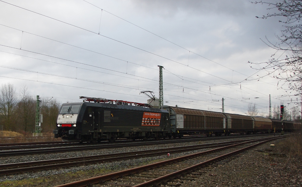 ES 64 F4-084 mit einem H-Wagen-Ganzzug in Fahrtrichtung Norden. Aufgenommen am 27.02.2011 in Eschwege West.