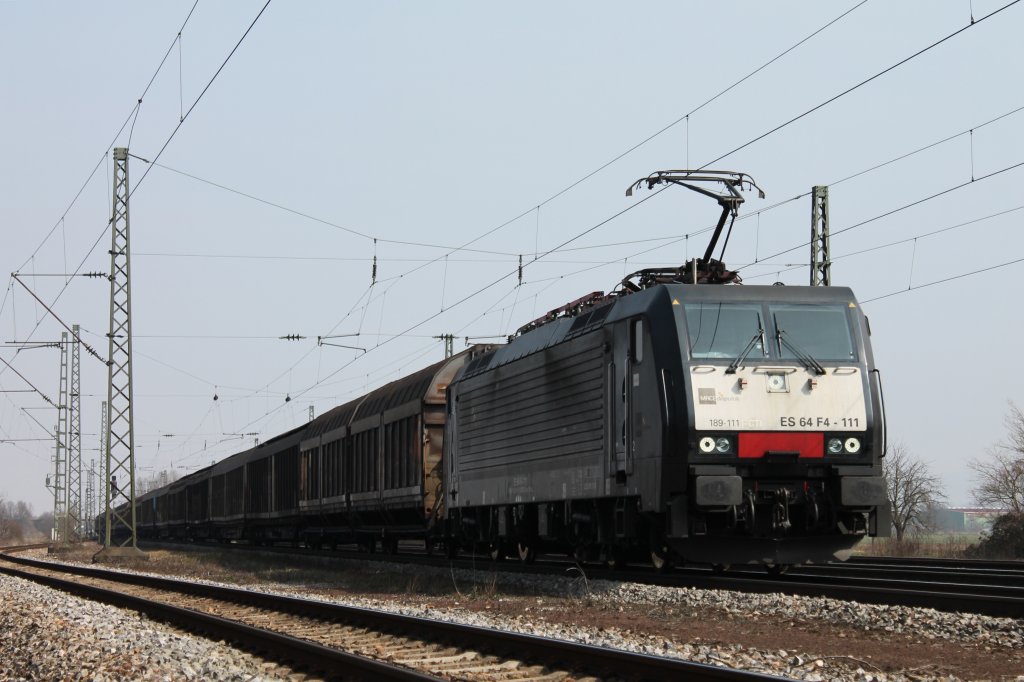 ES 64 F4-111 von Captrain mit einem Papierzug aus Dortmund nach Italien am 04.04.2013 kurz vor Orschweier.