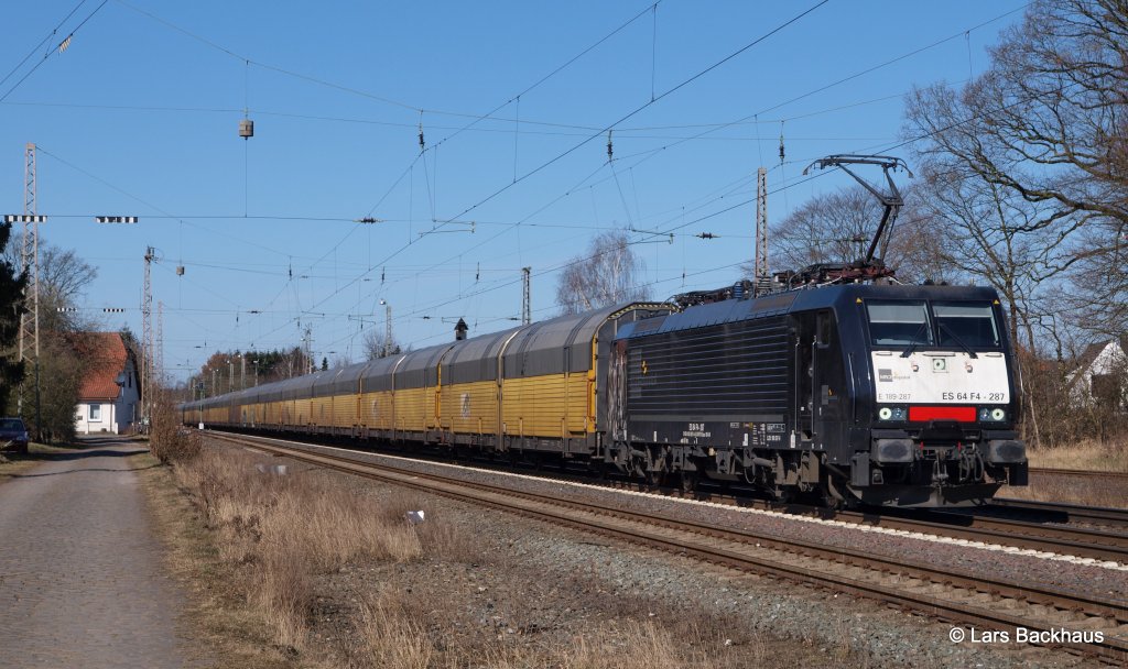 ES 64 F4-287 TXL hat am 24.03.13 einen langen ARS Autozug aus Bremerhaven am Haken und passiert hier gerade Langwedel Richtung Hannover.