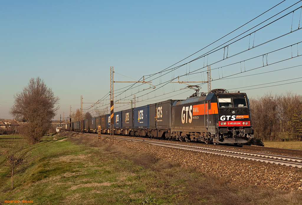 GTS RAIL E483 052GC (TRAXX F140 DC) hauls a GTS container train between Piacenza and Bologna, here just after Parma on the 11th of December in 2010