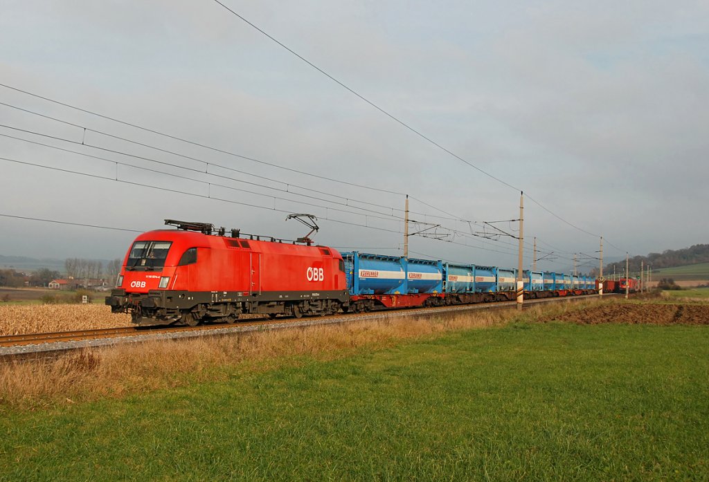 Kbrunner Rbenzug mit 1116 074 Richtung Westen, am 14.11.2009 kurz vor Ollersbach. Den Blick auf die Rben Leerwagen wird leider vom REX 1629 teilweise verdeckt.