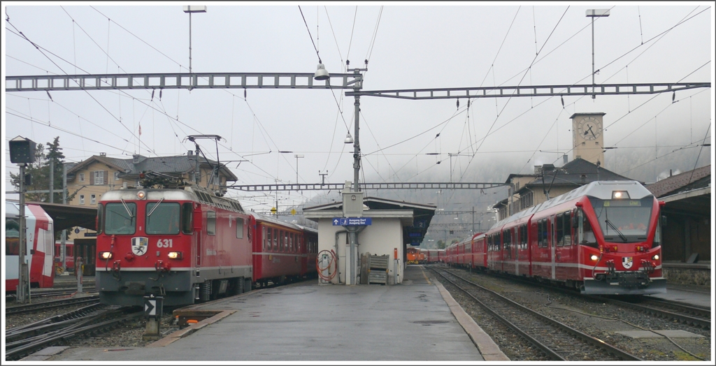 Leerzug mit Ge 4/4 II 631  Untervaz  verlsst St.Moritz. Daneben steht auf Gleis 1 RE1124 mit ABe 8/12 3501 abfahrbereit nach Chur. (08.05.2010)