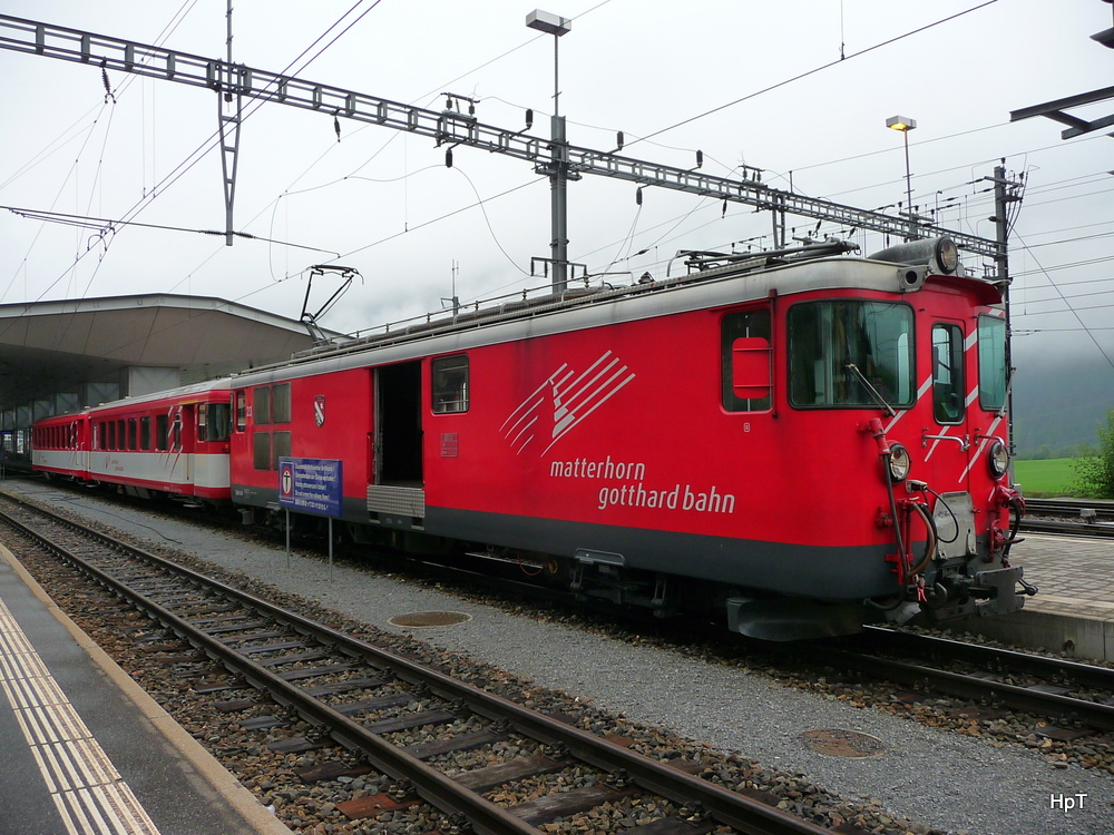 MGB - Zahnradtriebwagen Deh 4/4 23 vor Regio im Bahnhof Disentis am 17.09.2010