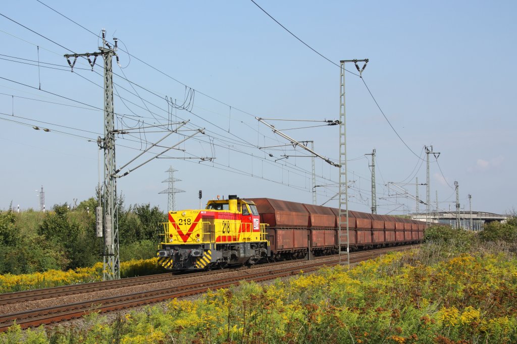 Mit dem Kohlependel von Buna nach Whlitz erreicht eine MaK G1206 der MEG (MEG 218/ 275 218-6) in Krze den Bahnhof Grokorbetha. Fotografiert am 22.08.2011. 