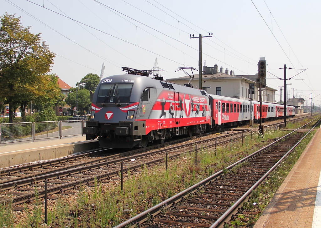 Nochmal 1116 138-9 bei der Ausfahrt mit dem REX nach St. Plten aus Wien Htteldorf. Aufgenommen am 03.07.2012.