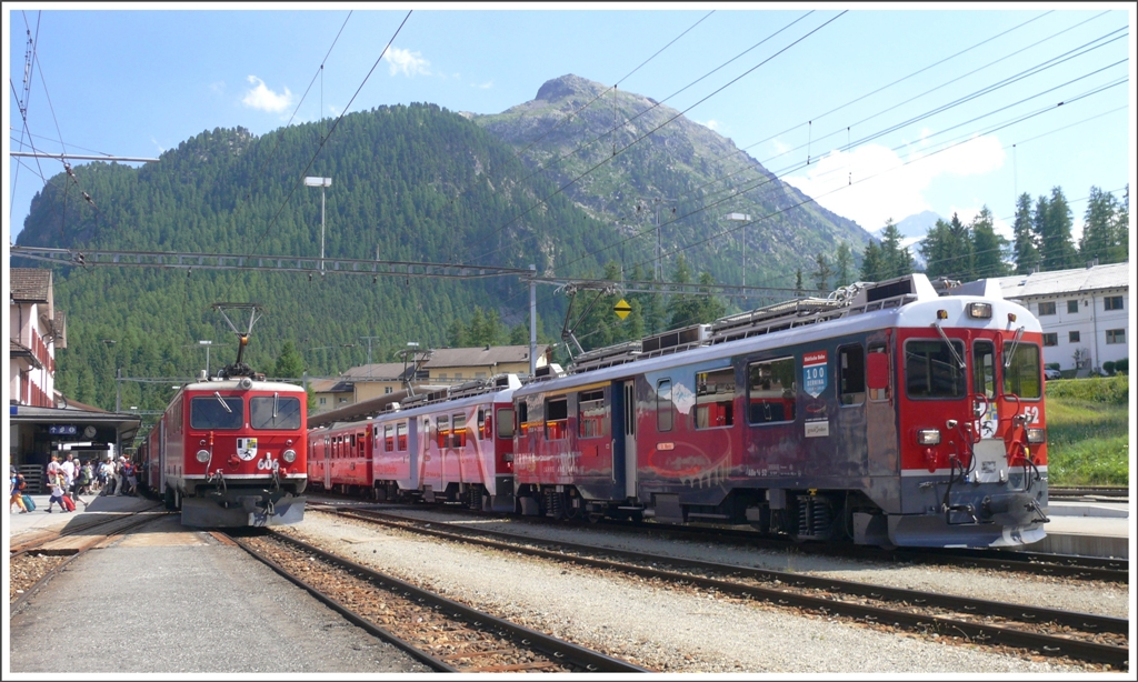 R1956 nach Scuol-Tarasp mit Ge 4/4 I 606  Kesch  und R1656 nach St.Moritz mit ABe 4/4 III 52  Brusio  und 51  Poschivo  in Pontresina. (14.07.2010)