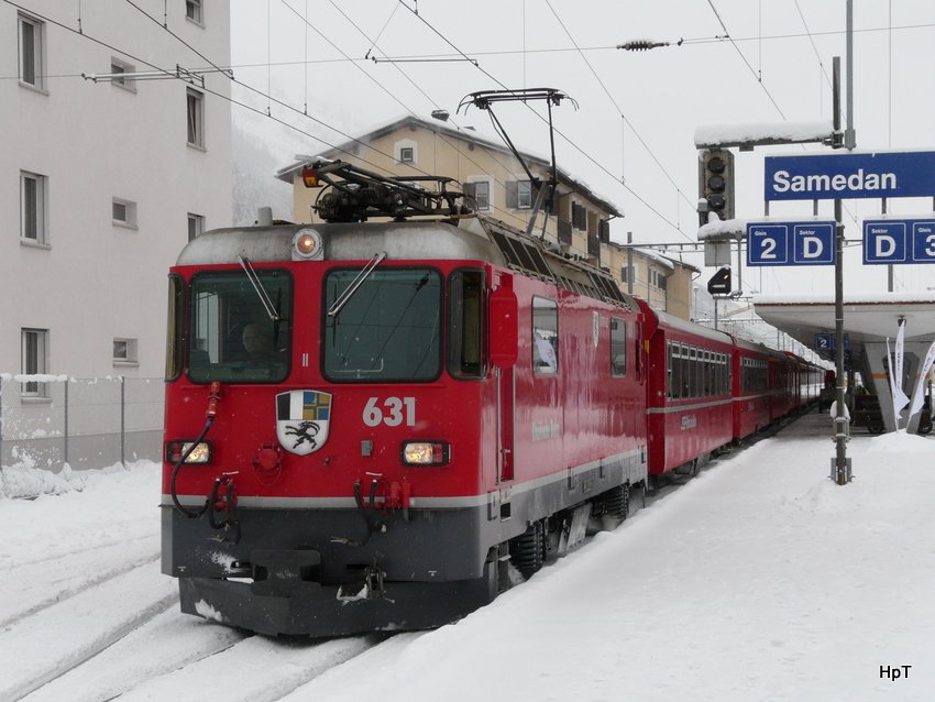 RhB - Ge 4/4 631 vor Schnellzug aus Chur nach St.Moritz im Bahnhof von Samedan am 04.12.2009