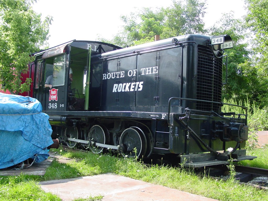 Rock Island diesel lok 348 was restored by Larry Raid of Denmark, Iowa. He is building his own full scale train layout on his property. He currently has about 500 feet of track and several switches. Expensive hobby! Since I am in a wheelchair I had to watch as my friend learned how to drive this lok and a caboose over to the road.