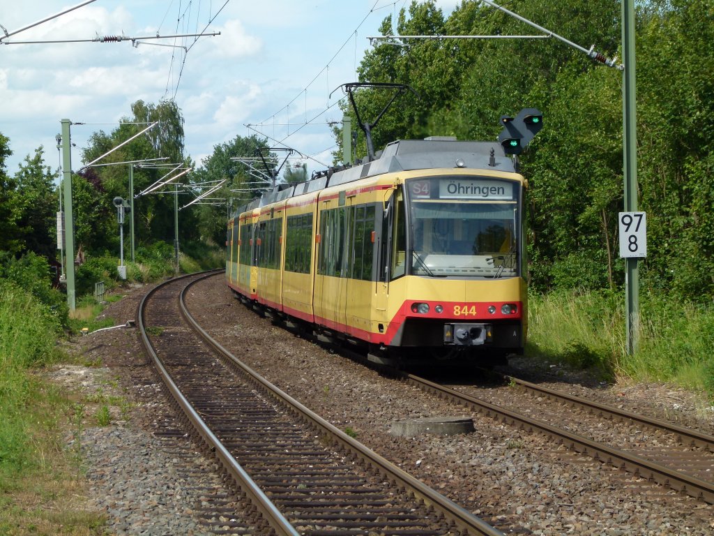 S4 der AVG mit der Nummer 844 fhrt gerade aus dem ehemaligen Bahnhof, heuteigen Haltepunkt Bretzfeld. Das Bild machte ich am 23.6.2011 vom Bahnsteig Gleis 1 in Bretzfeld.