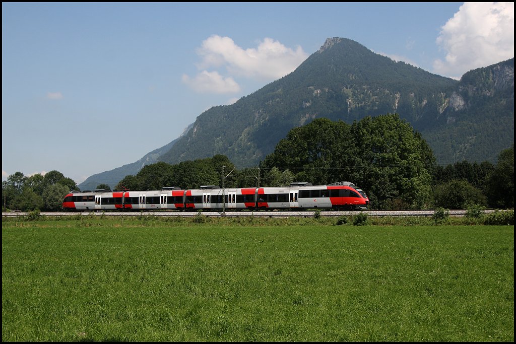 Talent als RB 5117, Rosenheim - Tefls-Pfaffenhofen, bei Niederaudorf unterwegs. (06.08.2009)