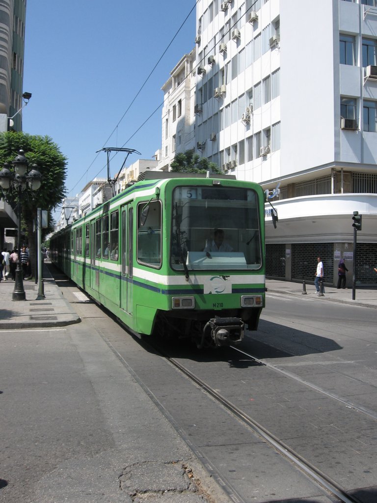 Train of the Tunis Metro leger in Tunisia. 10.07.2010. Cross road with avenue Habib Bourguiba.