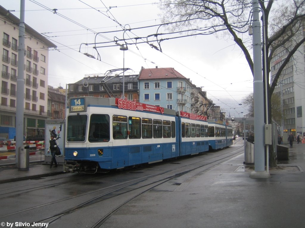 Tram 2000 Be 4/6 2008 ''Friesenberg'' + 2301 am 1.12.09 auf der Linie 14 beim Bhf. Zrich-Wiedikon.
