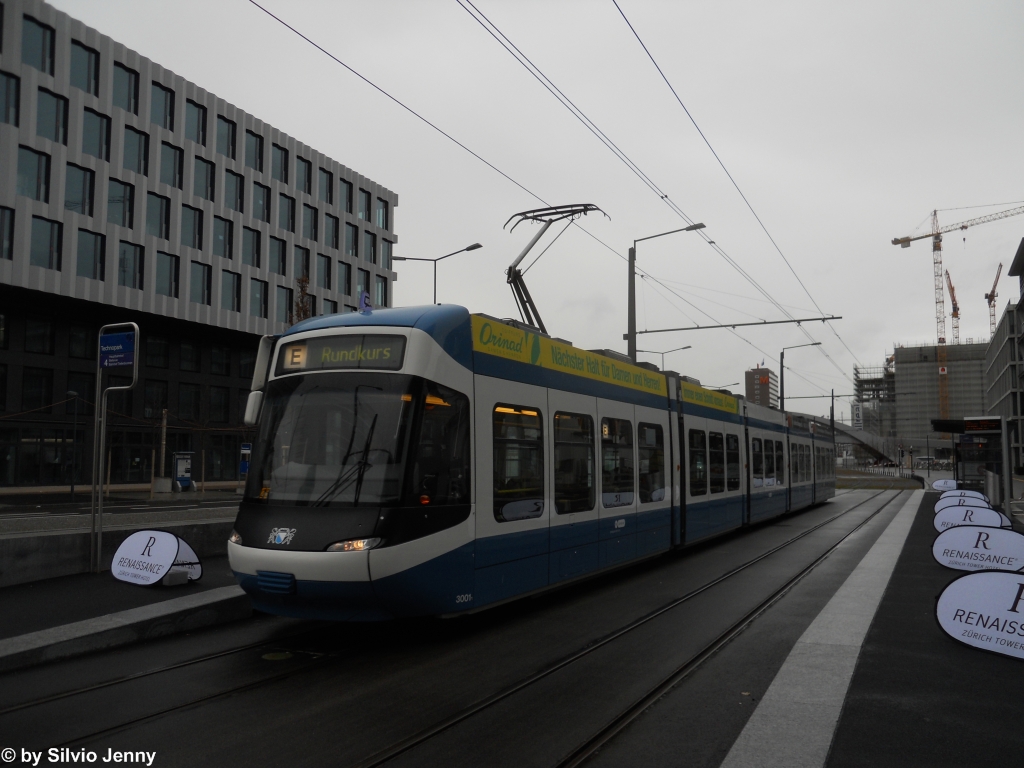VBZ Nr. 3001 (Be 5/6 ''Cobra'') am trben 10.12.2011 bei der neuen Haltestelle Technopark. Neben der Haltestelle Technopark steht ein weiteres Hochhaus in Zrich West, der ''Mobimo-Tower'', mit seinen ''nur'' 81 Meter Hhe steht er im Schatten des 126m hohen Prime-Towers. Im Mobimo-Tower befindet sich das Luxus-Hotel ''Renaissance'', fr das am Erffnungsfest des TZW Werbung gemacht wurde.