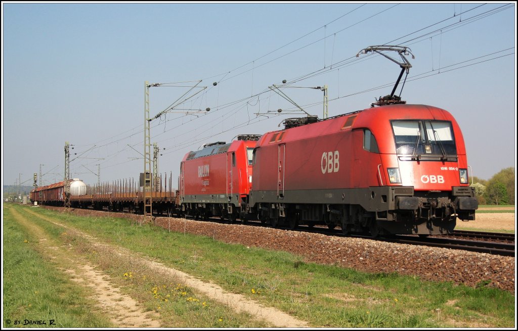 Wenn Deutschland und �sterreich sich die Hand reichen. In dem Fall konnte der Deutsche, in Form einer 185, nicht mehr weiter. So wurde 1016 004 vorgespannt um dem Gemischten GZ weiter nach Passau zu bringen. (19.04.2011, Mangolding)