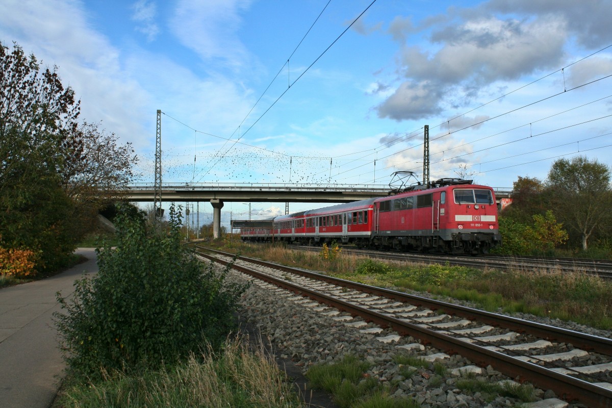 111 050-1 mit der RB 26566 von Neuenburg (Baden) nach Freiburg (Breisgau) Hbf am Nachmittag des 02.11.13 bei der Ausfahrt aus Mllheim (Baden).