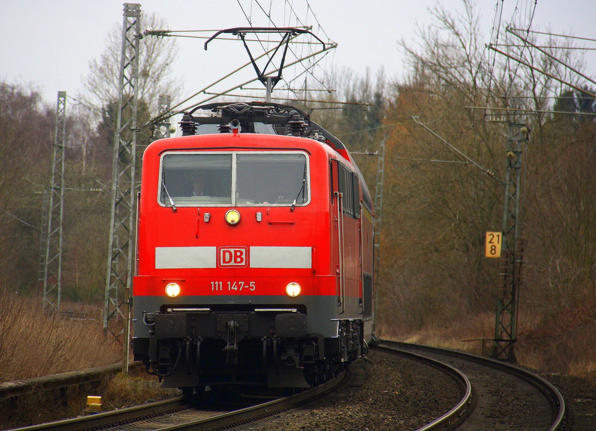 111 147-5 DB kommt mit dem RE4 aus Dortmund-Hbf nach Aachen-Hbf und kommt aus Richtung Rheydt,Wickrath,Beckrath,Herrath,Erkelenz,Baal,Hückelhoven-Baal,Brachelen,,Lindern,Süggerrath,Geilenkirchen,Frelenberg,Zweibrüggen und hat gerade eben in Übach-Palenberg gehalten und fährt weiter in Richtung Finkenrath,Hofstadt,Herzogenrath,Kohlscheid,Richterich,Laurensberg,Aachen-West,Aachen-Schanz,Aachen-Hbf.
Aufgenommen am Bahnübergang in Rimburg im Wurmtal. 
Bei Wolken am Kalten 19.3.2016. 