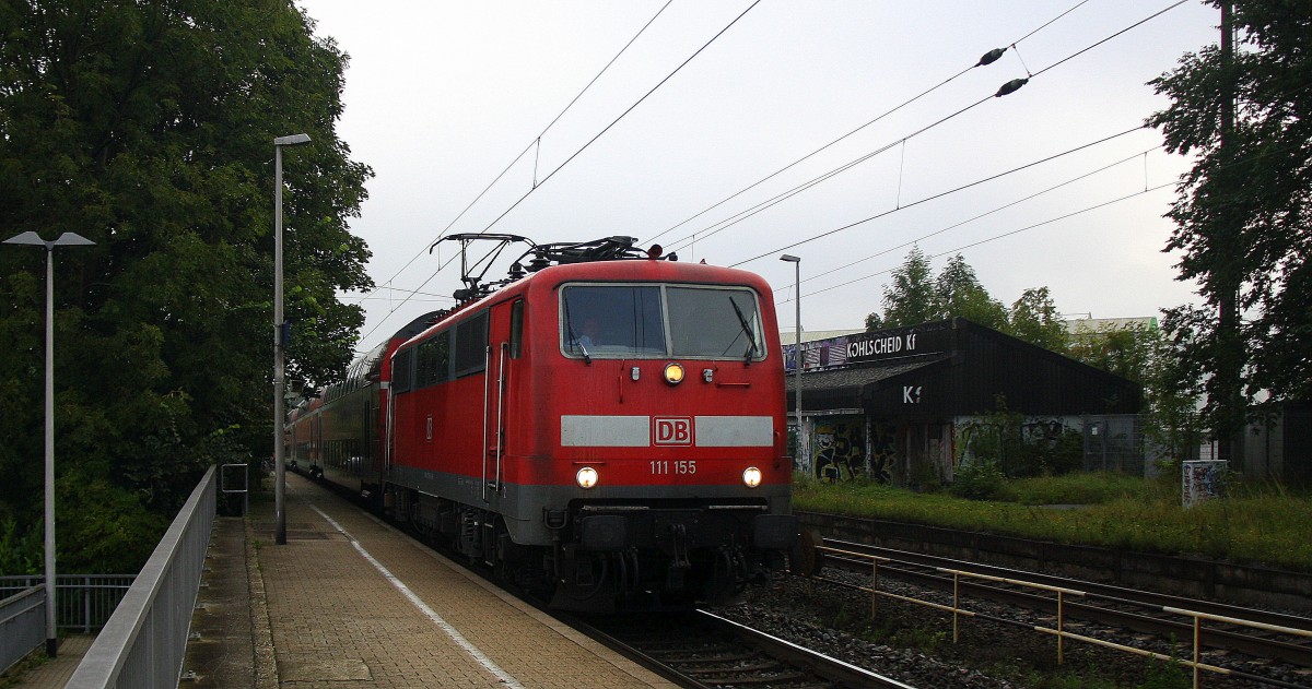 111 155 DB kommt die Kohlscheider-Rampe hoch aus Richtung Neuss,Herzogenrath mit dem RE4 aus Dortmund-Hbf-Aachen-Hbf und fährt durch Kohlscheid in Richtung Richterich,Laurensberg,Aachen-West bei Sonne und Wolken am Morgen vom 27.8.2014.