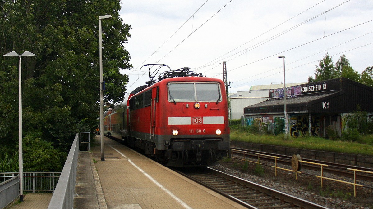111 160-8 DB kommt die Kohlscheider-Rampe hoch aus Richtung Neuss,Herzogenrath mit dem RE4 aus Dortmund-Hbf-Aachen-Hbf und fährt durch Kohlscheid in Richtung Richterich,Laurensberg,Aachen-West bei Sonne und Wolken am Nachmittag vom 22.8.2014.