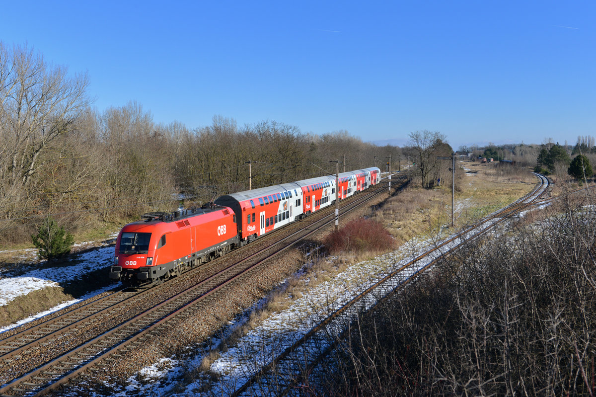 1116 036 mit einem REX am 06.01.2015 bei Strasshof. 