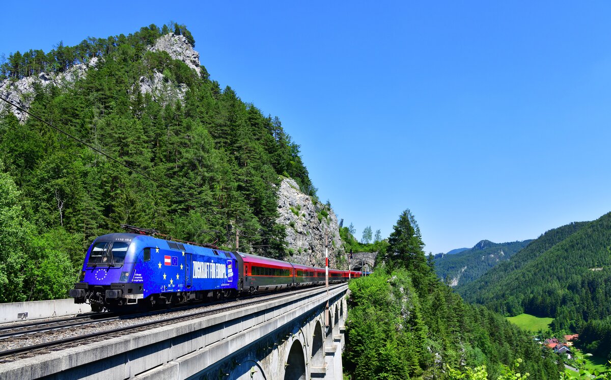 1116 154 mit dem RJ 110 nach München Hbf via Graz - Klagenfurt - Salzburg am 27.06.2026 bei Breitenstein am Semmering.
